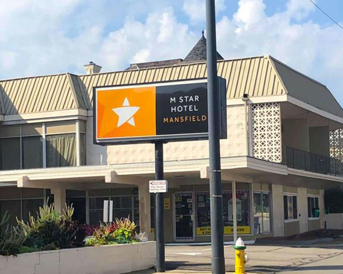 Exterior view of M Star Hotel Mansfield with branded signage and entrance.