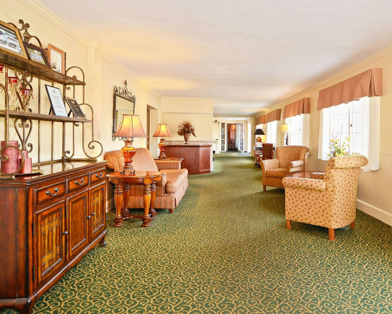 Comfortable and welcoming hotel lobby at Jamestown Grand with classic furnishings and soft lighting.