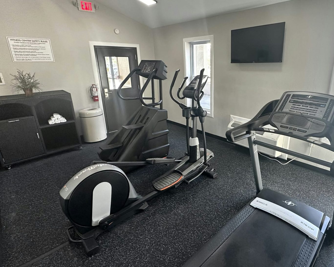On-site fitness center with treadmill and elliptical machines at Magnuson Hotel Detroit.