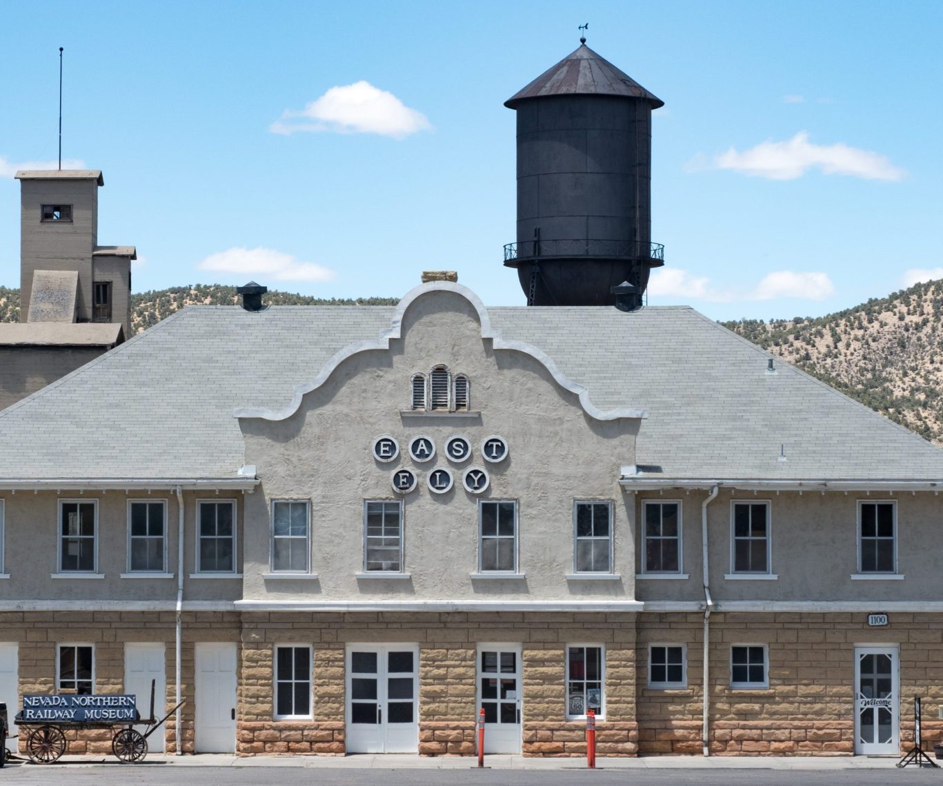 Historic East Ely Nevada Northern Railway Museum building with water tower in the background.