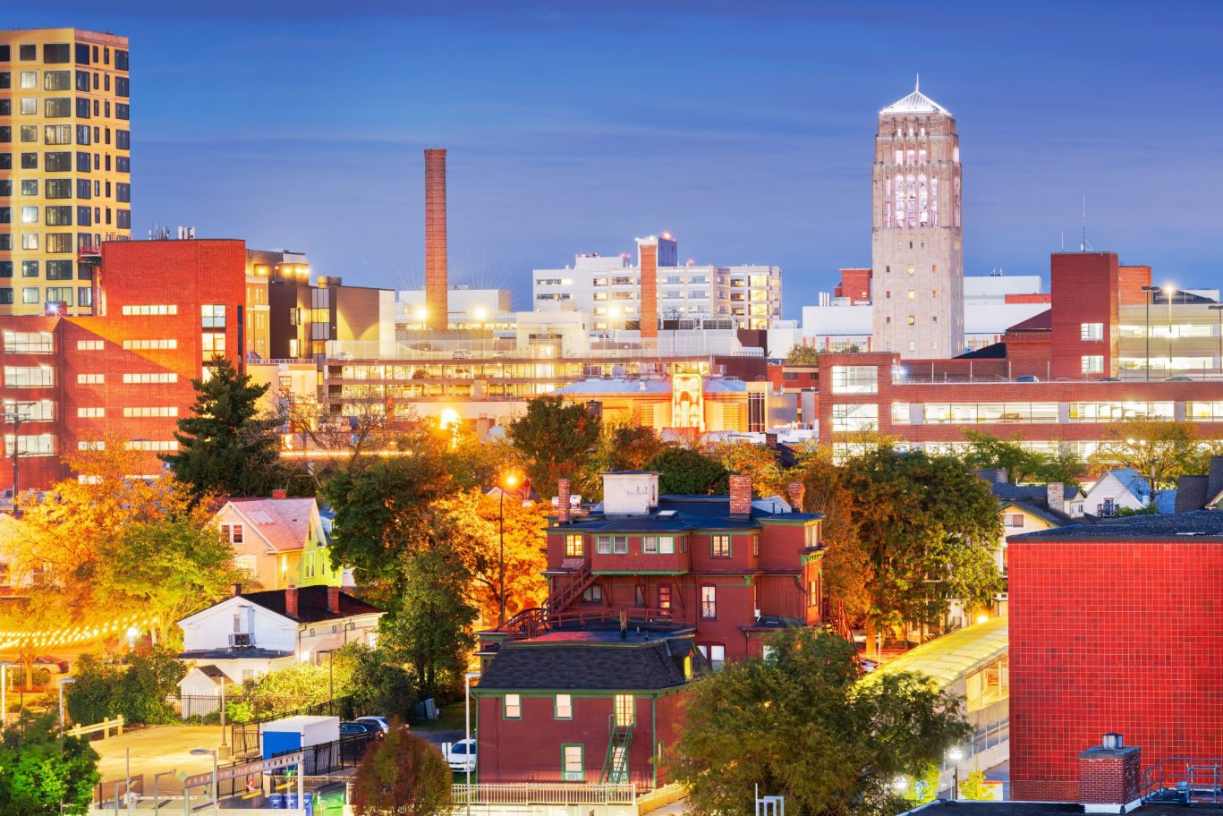 Evening cityscape of downtown Ann Arbor, Michigan illuminated with vibrant lights and architecture.