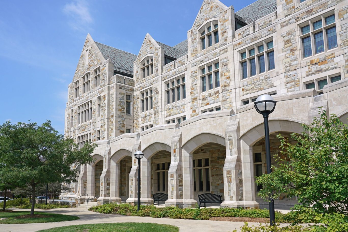 shutterstock_2267093711 – Ann Arbor, Michigan – Campus of the University of Michigan with traditional gothic style stone buildings with gables