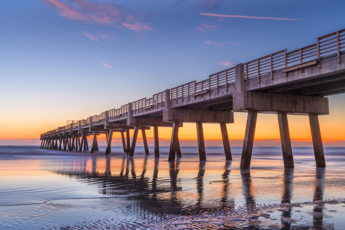 shutterstock_1745514701 – Jacksonville, Florida, USA beach view with Jacksonville Pier at dawn.
