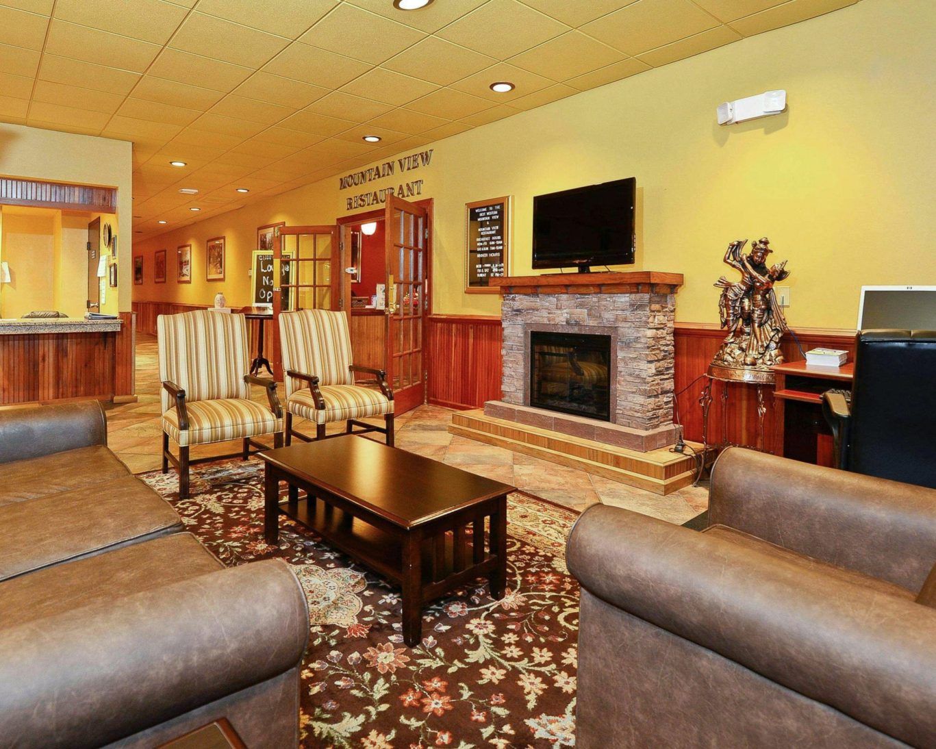 Cozy hotel lobby with fireplace and classic armchairs in Hiawassee, Georgia.