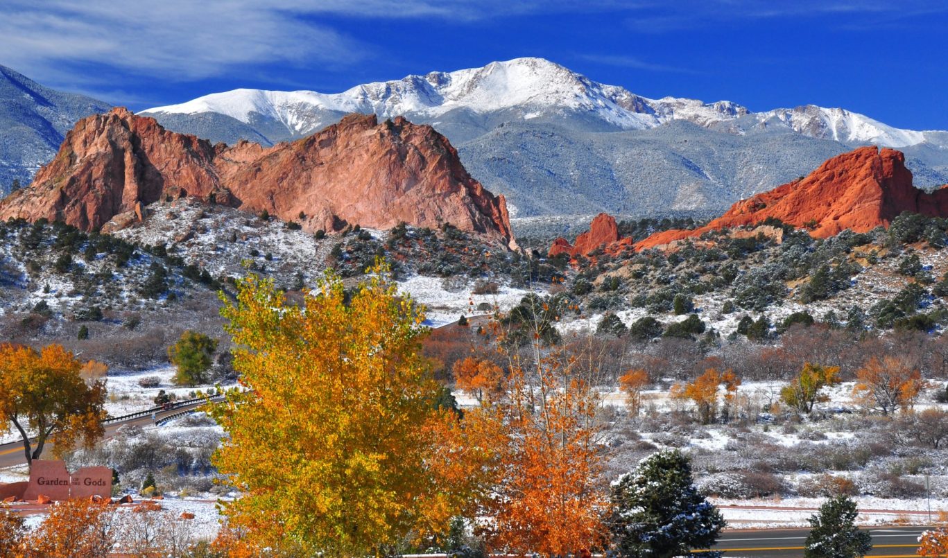 Scenic view of Garden of the Gods rock formations and snow-capped Pikes Peak in Colorado Springs.