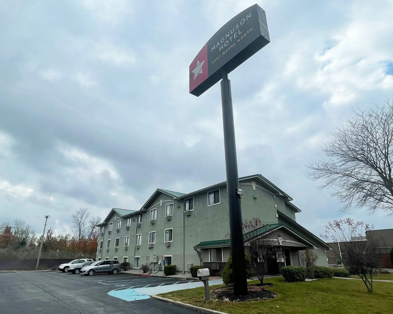Exterior of Magnuson Hotel Fort Wayne North with branded signage and parking lot.