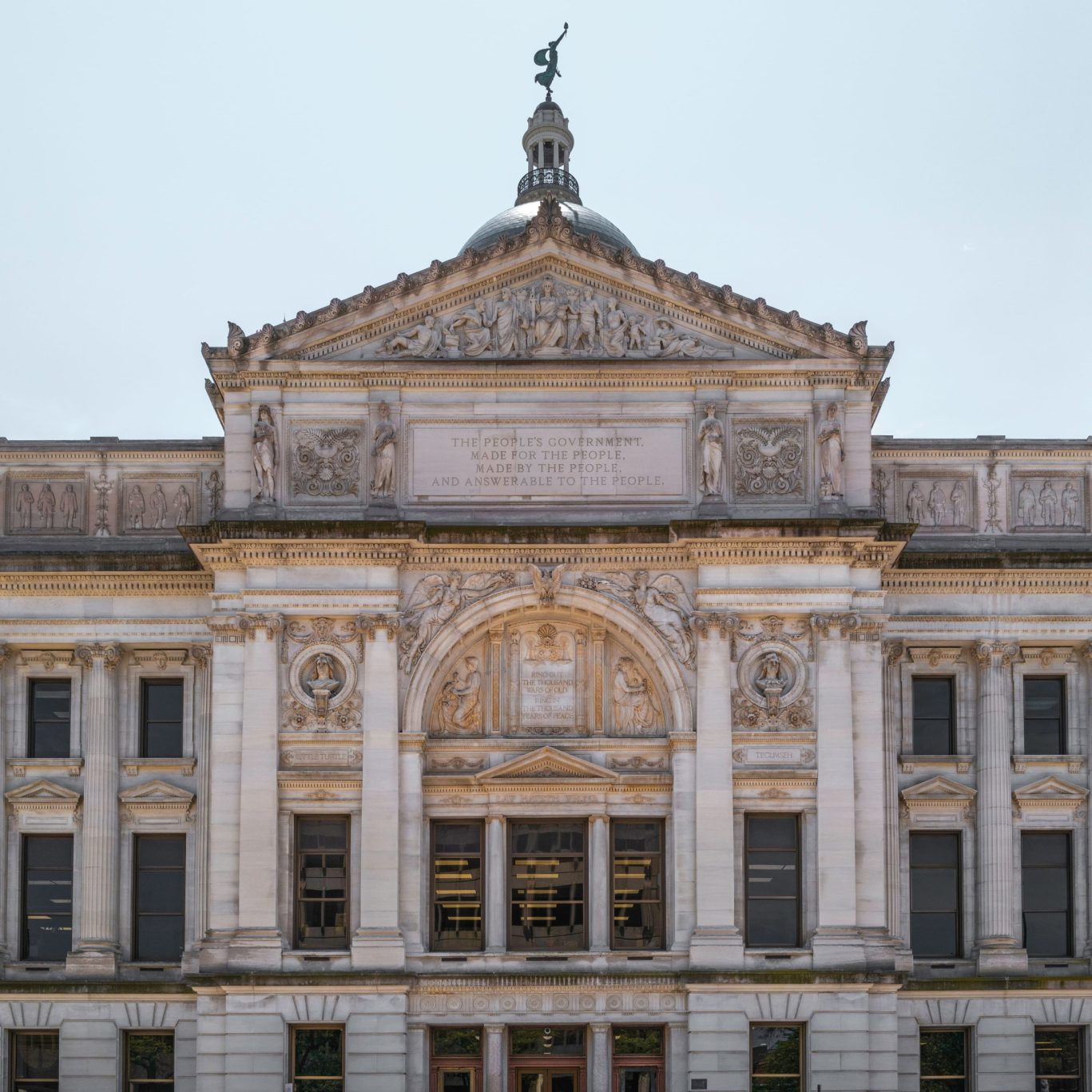 Front view of a historic courthouse building with classical architecture.