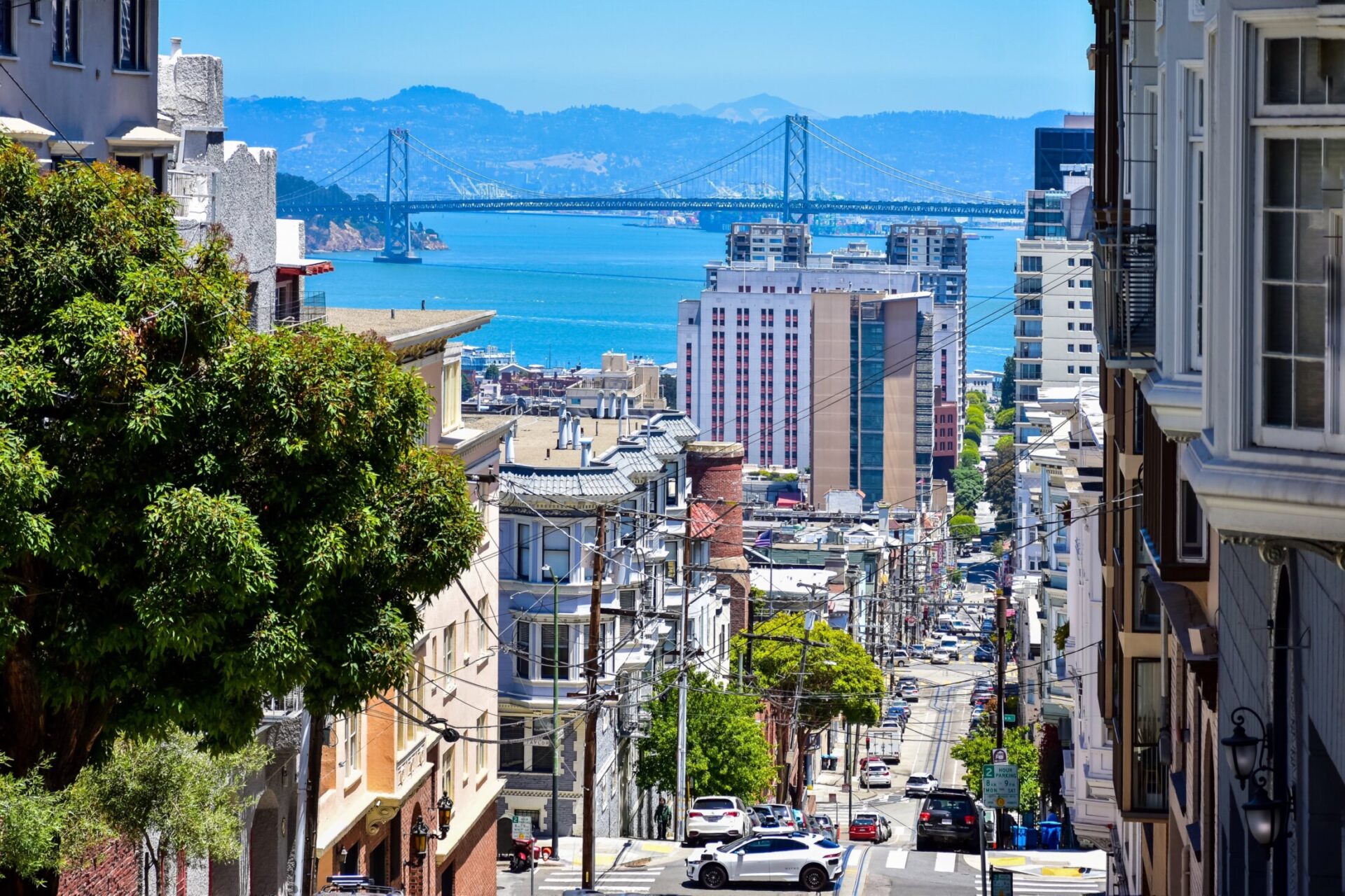 San Francisco city view with steep streets and Bay Bridge in the background
