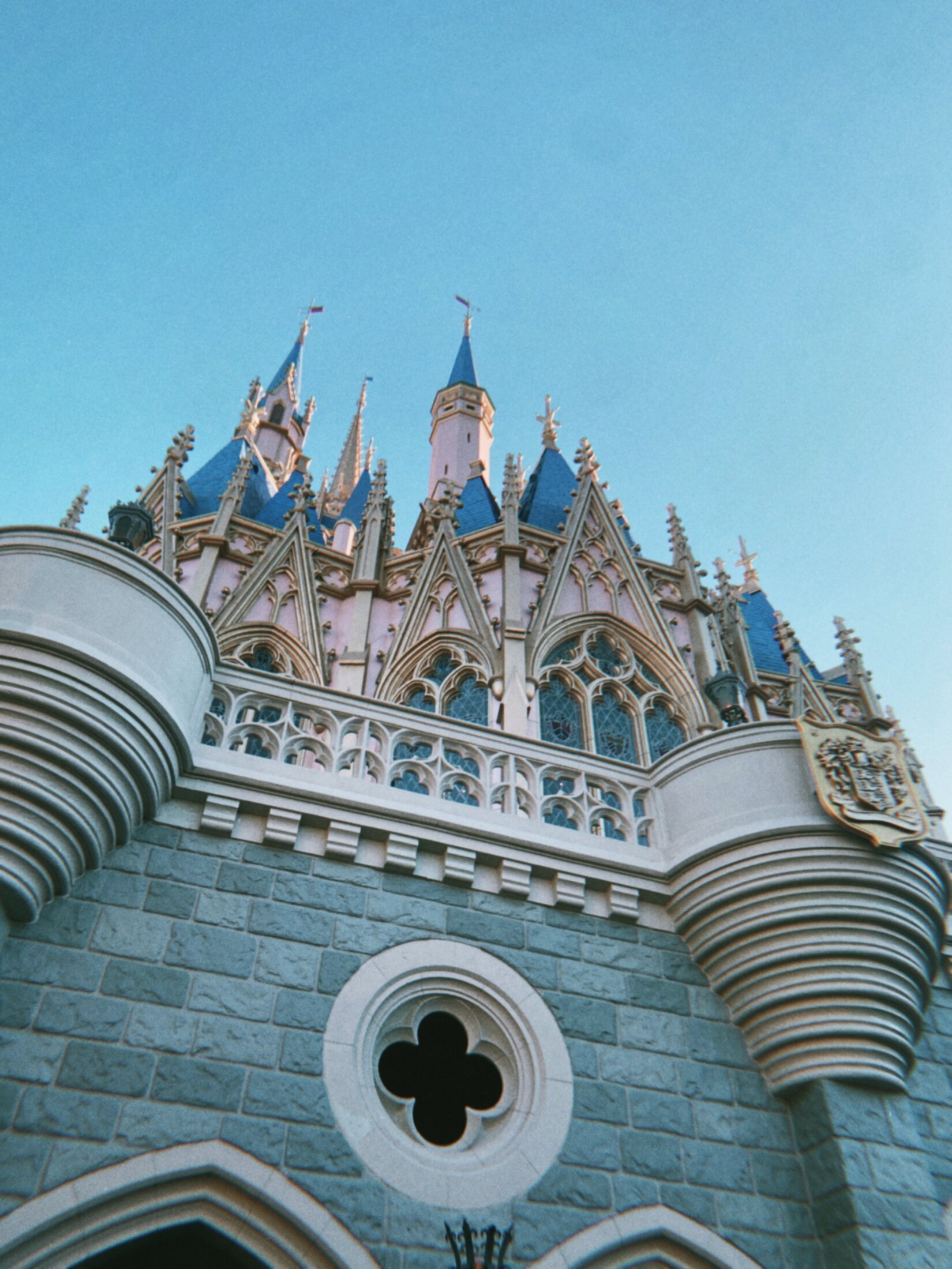 Iconic Disney World princess castle with blue turrets in Orlando, Florida