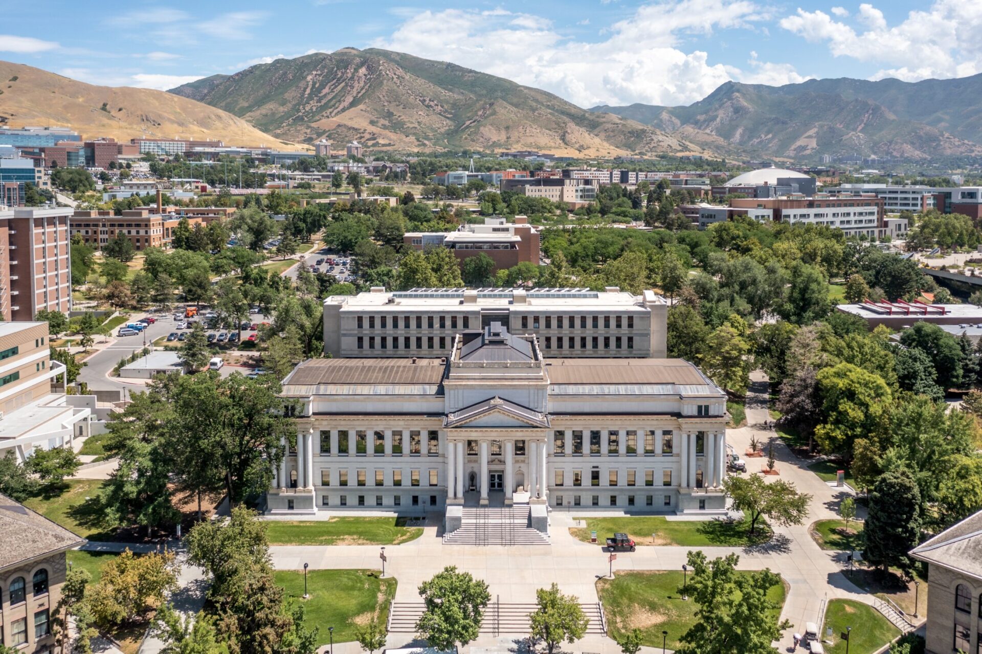 Aerial view of Utah State University campus with Wasatch Mountains in the background